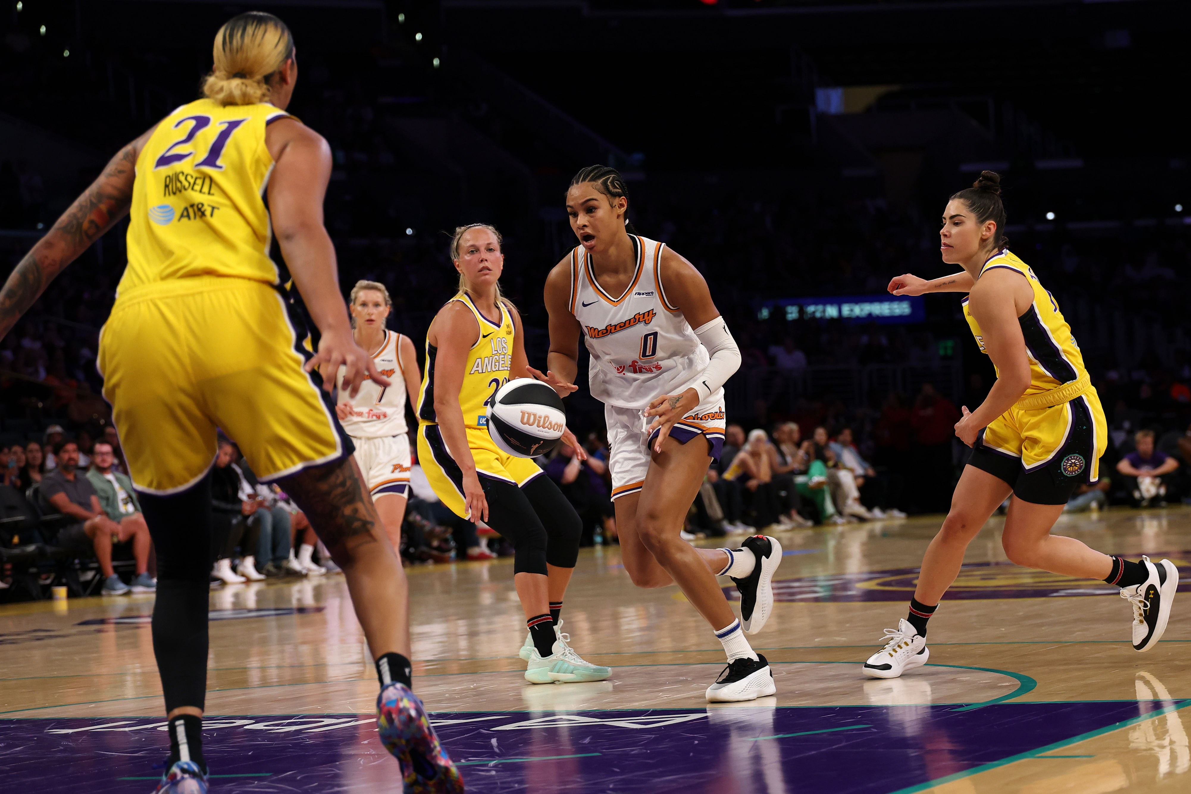 Phoenix Mercury forward Satou Sabally (#0) dribbles the ball against Los Angeles Sparks center Mercedes Russell (21) during the first half at Crypto.com Arena. Photo: Imagn